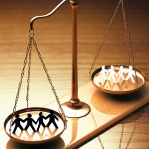 Scales of justice equaling races without prejudice or racism. Clipping path included.